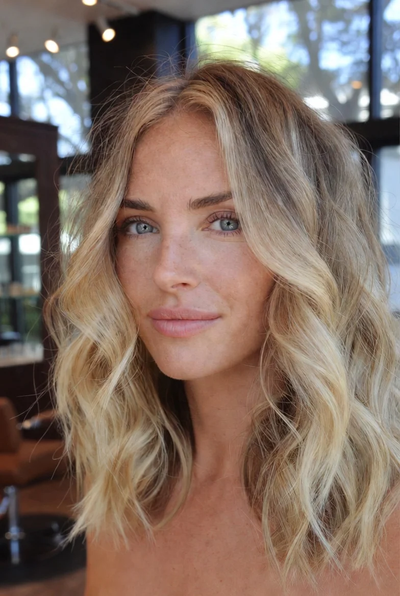 Lived-in blonde balayage with beach waves